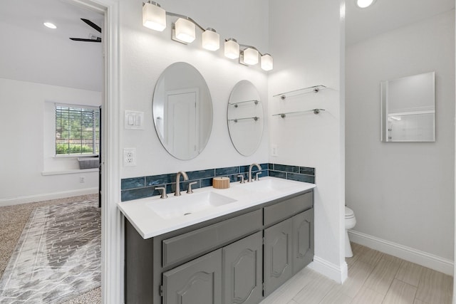 4901 Marcus Dr, Flower Mound, TX 75028 - bathroom featuring double vanity and backsplash