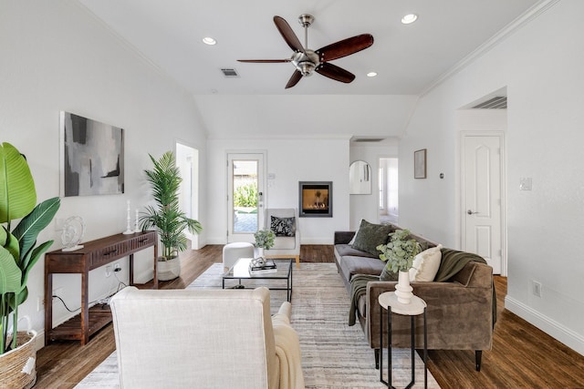 4901 Marcus Dr, Flower Mound, TX 75028 - living room with lofted ceiling, ceiling fan, wood finished floors, crown molding, and recessed lighting