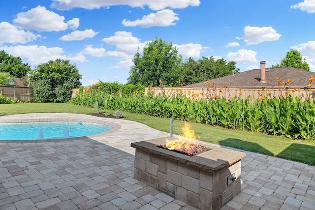 4901 Marcus Dr, Flower Mound, TX 75028 - view of swimming pool with a fire pit, a patio area, and a fenced backyard