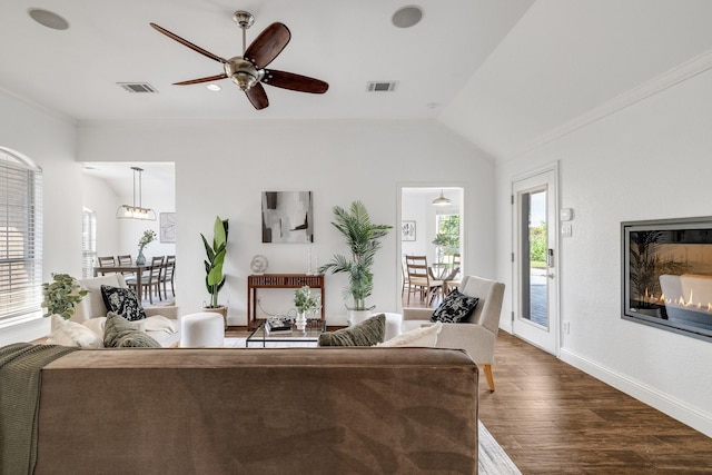 4901 Marcus Dr, Flower Mound, TX 75028 - living area featuring dark wood finished floors, a ceiling fan, vaulted ceiling, and crown molding