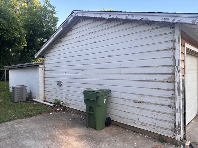 1305 Hadley Dr, Arlington, TX 76011 - view of home's exterior with a central air condition unit and a garage