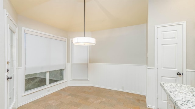 2512 Woodhaven Dr, Flower Mound, TX 75028 - unfurnished dining area featuring a wainscoted wall