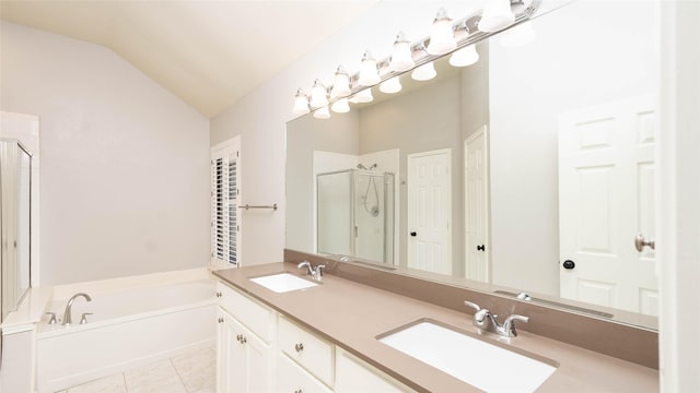 2512 Woodhaven Dr, Flower Mound, TX 75028 - full bath with a stall shower, lofted ceiling, a bath, double vanity, and tile patterned floors