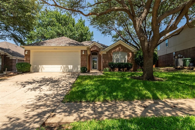 2512 Woodhaven Dr, Flower Mound, TX 75028 - ranch-style home with brick siding, an attached garage, driveway, and a front yard