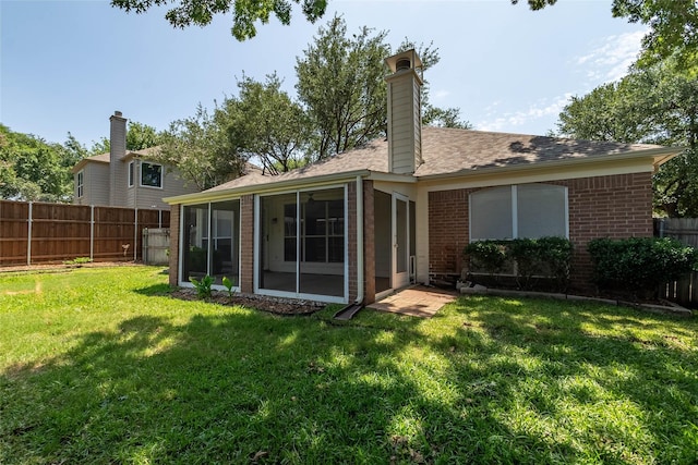 2512 Woodhaven Dr, Flower Mound, TX 75028 - back of property featuring brick siding, a sunroom, a fenced backyard, and a chimney