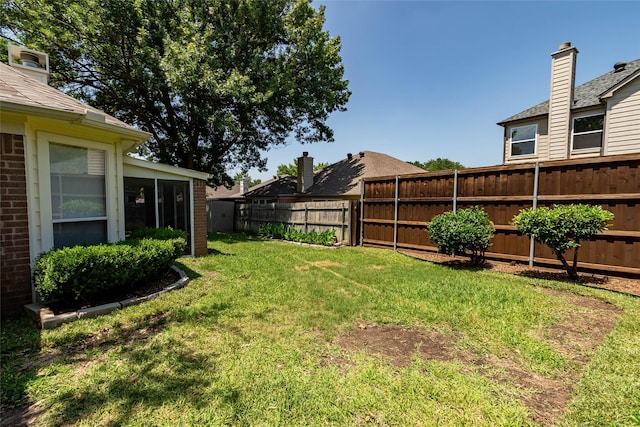 2512 Woodhaven Dr, Flower Mound, TX 75028 - fenced backyard with a sunroom