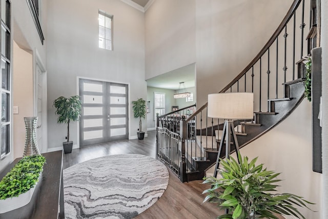 407 Emerson Dr, Rockwall, TX 75087 - entryway with wood finished floors, plenty of natural light, french doors, stairs, and a towering ceiling