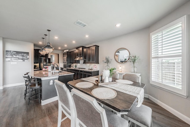 407 Emerson Dr, Rockwall, TX 75087 - dining area with dark wood-style floors, a chandelier, and recessed lighting