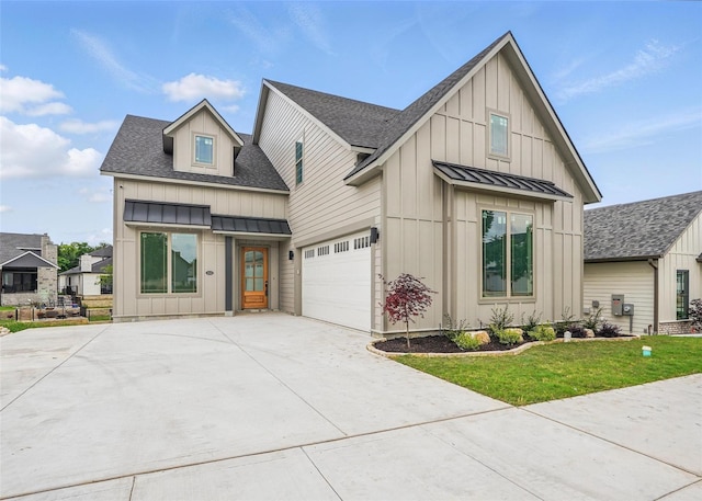 1022 Bow St, Rockwall, TX 75087 - modern farmhouse with board and batten siding, a standing seam roof, a shingled roof, driveway, and a metal roof