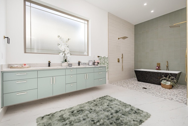 1022 Bow St, Rockwall, TX 75087 - bathroom with marble finish floors, double vanity, a tile shower, a freestanding tub, and recessed lighting