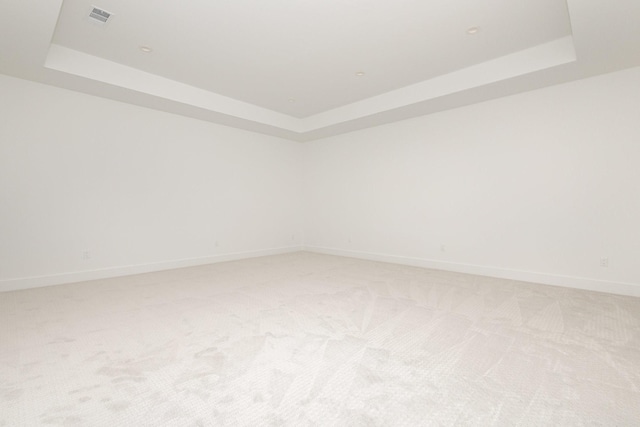 1022 Bow St, Rockwall, TX 75087 - empty room with a raised ceiling and light carpet