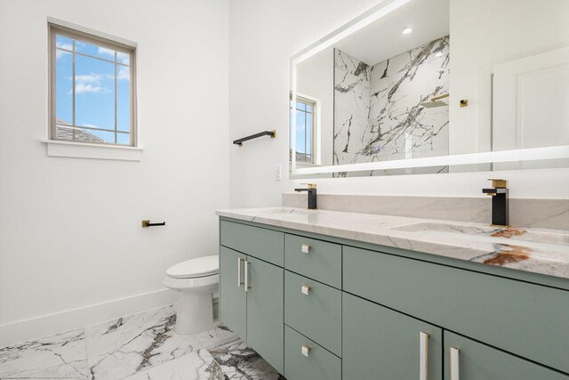 1022 Bow St, Rockwall, TX 75087 - full bath featuring marble look tiles, double vanity, plenty of natural light, and a marble finish shower