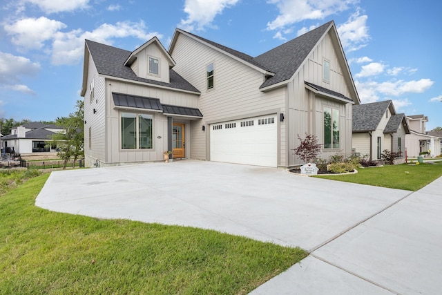 1022 Bow St, Rockwall, TX 75087 - modern farmhouse featuring board and batten siding, a garage, roof with shingles, a front lawn, and driveway