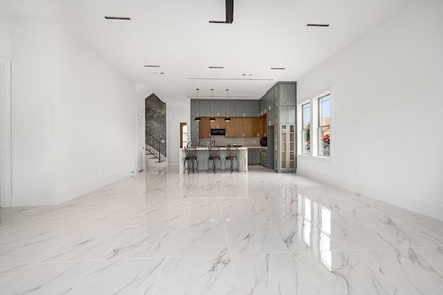 1022 Bow St, Rockwall, TX 75087 - living room with light marble finish floors and stairway