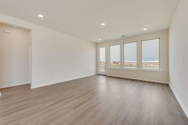 1502 Salem Dr, Forney, TX 75126 - spare room featuring wood finished floors and recessed lighting