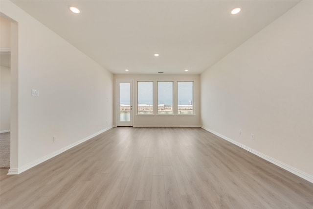 1502 Salem Dr, Forney, TX 75126 - unfurnished living room featuring light wood-style floors and recessed lighting