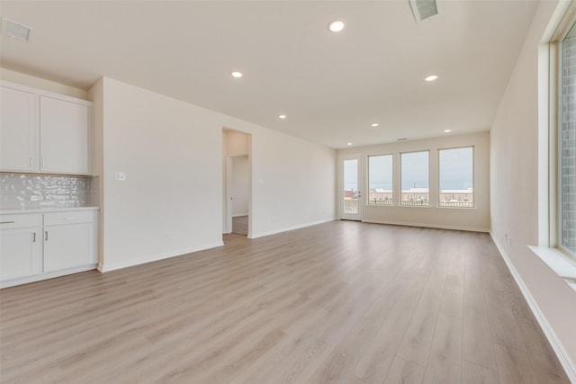 1502 Salem Dr, Forney, TX 75126 - unfurnished living room featuring light wood-style floors and recessed lighting