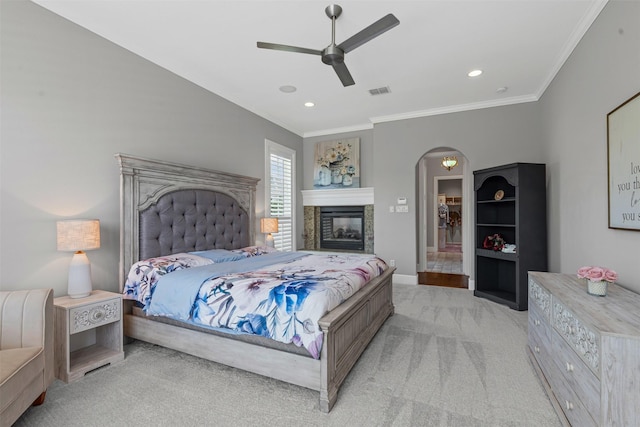 2305 Castle Creek Dr, Mansfield, TX 76063 - bedroom featuring crown molding, light colored carpet, arched walkways, a ceiling fan, and recessed lighting