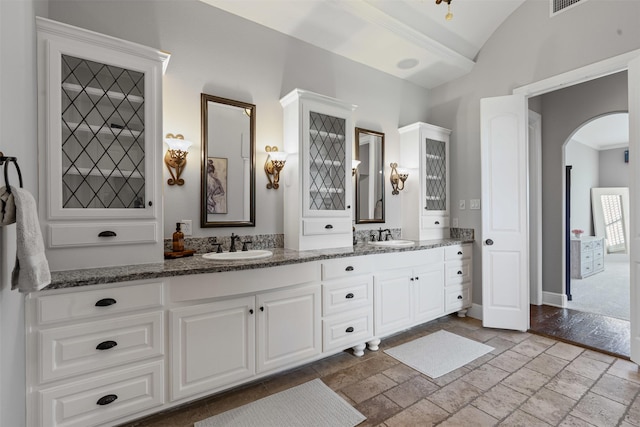 2305 Castle Creek Dr, Mansfield, TX 76063 - bathroom featuring double vanity and stone tile flooring