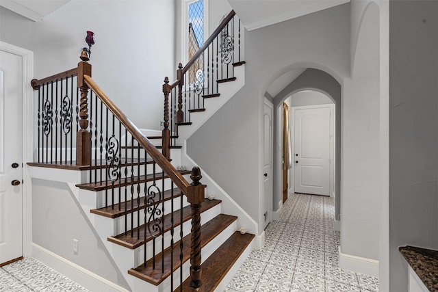 2305 Castle Creek Dr, Mansfield, TX 76063 - stairs with arched walkways and tile patterned floors