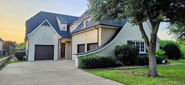 2305 Castle Creek Dr, Mansfield, TX 76063 - view of front facade with driveway, a lawn, and a garage