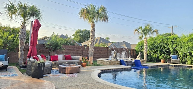 2305 Castle Creek Dr, Mansfield, TX 76063 - view of swimming pool with an outdoor living space with a fire pit, a patio area, and a fenced backyard