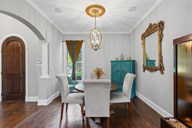 2305 Castle Creek Dr, Mansfield, TX 76063 - dining room with arched walkways, dark wood finished floors, ornate columns, a chandelier, and ornamental molding