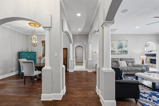 2305 Castle Creek Dr, Mansfield, TX 76063 - hallway featuring carpet flooring, crown molding, arched walkways, ornate columns, and recessed lighting