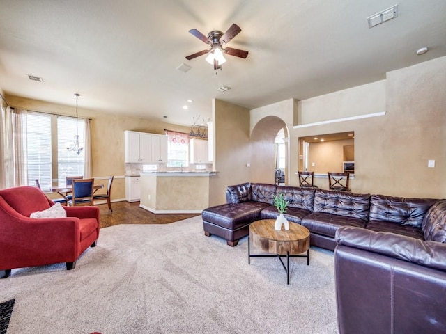 1721 Cross Point Rd, Mckinney, TX 75070 - living room with plenty of natural light, ceiling fan, carpet flooring, and arched walkways