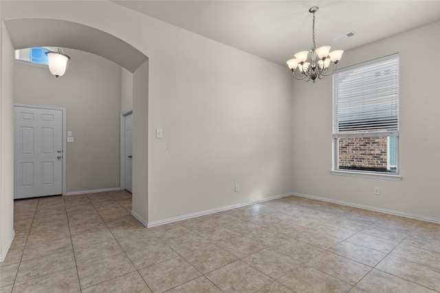 5201 Datewood Ln, Mckinney, TX 75071 - unfurnished room featuring a chandelier, healthy amount of natural light, arched walkways, and light tile patterned flooring