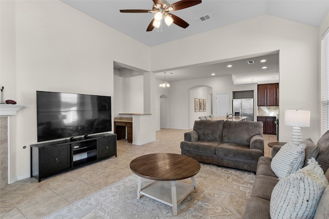 5201 Datewood Ln, Mckinney, TX 75071 - living area featuring arched walkways, ceiling fan, light tile patterned floors, recessed lighting, and high vaulted ceiling