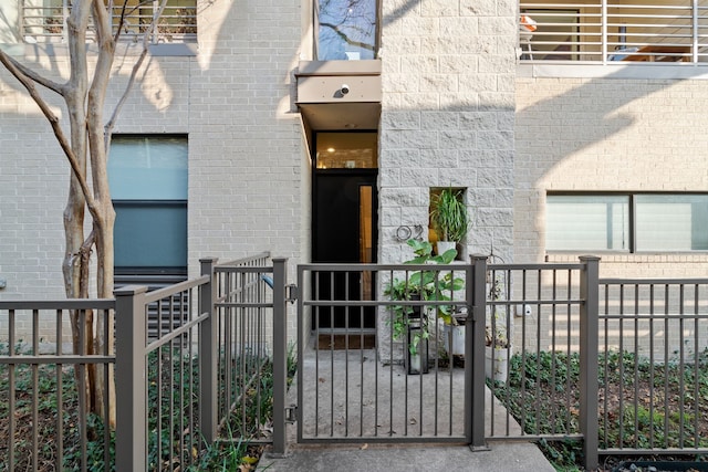 4111 Newton Ave Unit 2, Dallas, TX 75219 - doorway to property with a gate and brick siding