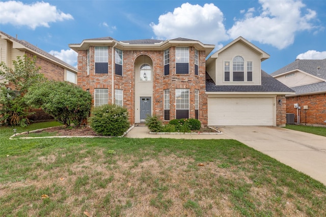 7504 Lomo Alto, Plano, TX 75024 - traditional-style home featuring driveway, a front lawn, a garage, and brick siding