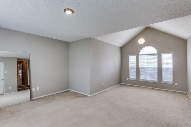 7504 Lomo Alto, Plano, TX 75024 - spare room featuring light carpet, a textured ceiling, and lofted ceiling