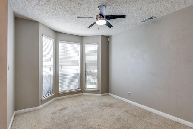 7504 Lomo Alto, Plano, TX 75024 - empty room with a ceiling fan, carpet floors, and a textured ceiling