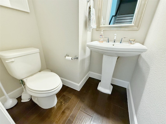 5339 Holland Ave, Dallas, TX 75209 - half bath with wood finished floors and toilet