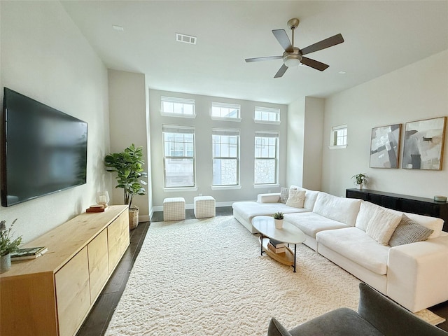 5339 Holland Ave, Dallas, TX 75209 - living area featuring dark wood-type flooring, plenty of natural light, and ceiling fan