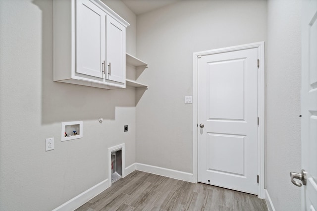 3680 Twin Pines Dr, Grand Prairie, TX 76065 - laundry room with hookup for an electric dryer, cabinet space, hookup for a washing machine, and light wood finished floors