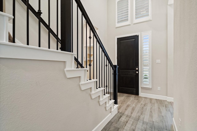 3680 Twin Pines Dr, Grand Prairie, TX 76065 - foyer entrance featuring wood finished floors and stairs