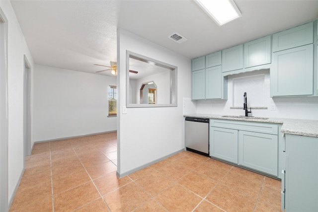 10900 Fm 1189, Lipan, TX 76462 - kitchen with stainless steel dishwasher, ceiling fan, backsplash, light stone countertops, and light tile patterned floors