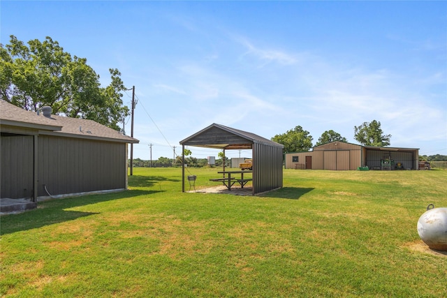 10900 Fm 1189, Lipan, TX 76462 - view of grassy yard featuring an outbuilding and an outdoor structure