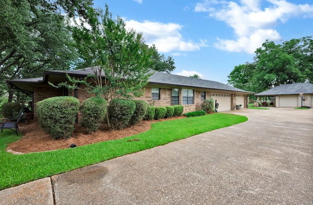 112 Rolling Meadow Ln, Bossier City, LA 71112 - ranch-style house featuring brick siding, concrete driveway, an attached garage, and a front lawn