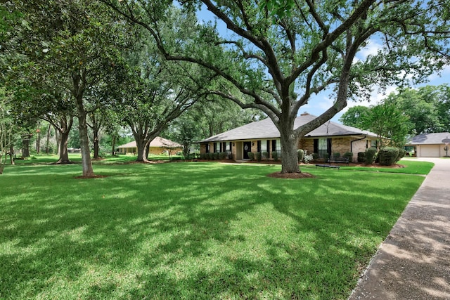 112 Rolling Meadow Ln, Bossier City, LA 71112 - view of grassy yard featuring a garage