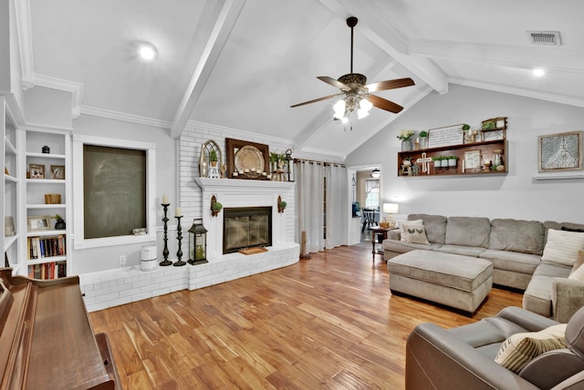112 Rolling Meadow Ln, Bossier City, LA 71112 - living room featuring a ceiling fan, wood finished floors, and a fireplace