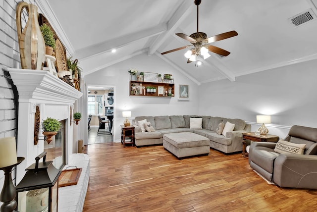 112 Rolling Meadow Ln, Bossier City, LA 71112 - living area featuring ceiling fan, light wood-style floors, and a fireplace with raised hearth