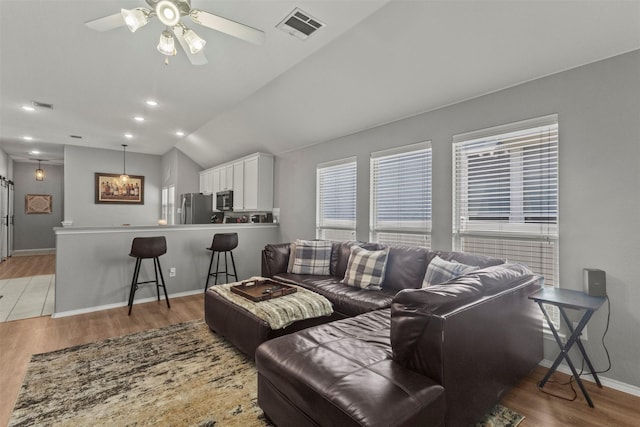 1732 Jasmine Trl, Savannah, TX 76227 - living room with light wood-type flooring, ceiling fan, and lofted ceiling