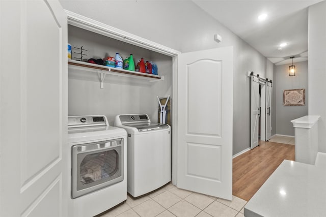 1732 Jasmine Trl, Savannah, TX 76227 - washroom featuring a barn door, separate washer and dryer, recessed lighting, and light tile patterned floors