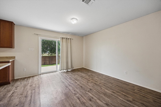 330 Broken Bow, Krum, TX 76249 - unfurnished dining area with wood finished floors