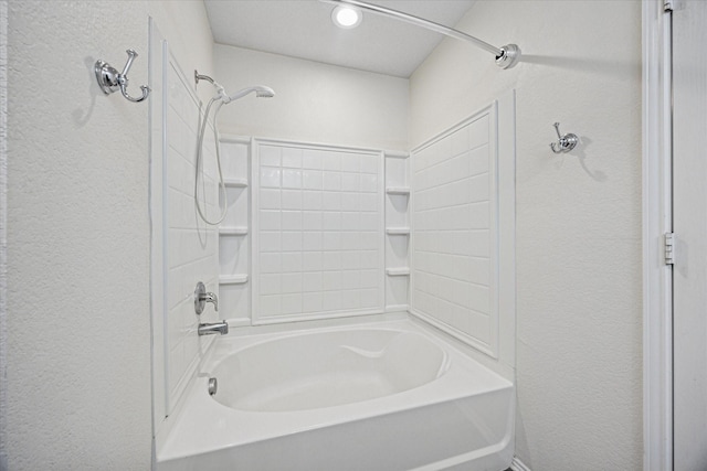 330 Broken Bow, Krum, TX 76249 - bathroom with a textured wall, bathing tub / shower combination, and recessed lighting