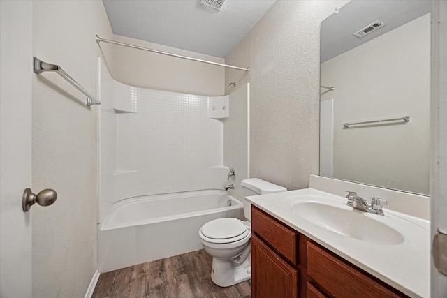 330 Broken Bow, Krum, TX 76249 - full bath featuring wood finished floors, bathtub / shower combination, vanity, and a textured wall